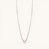 Nadare Co. freshwater pearl chain necklace with a gold-toned circular clasp on a light background.