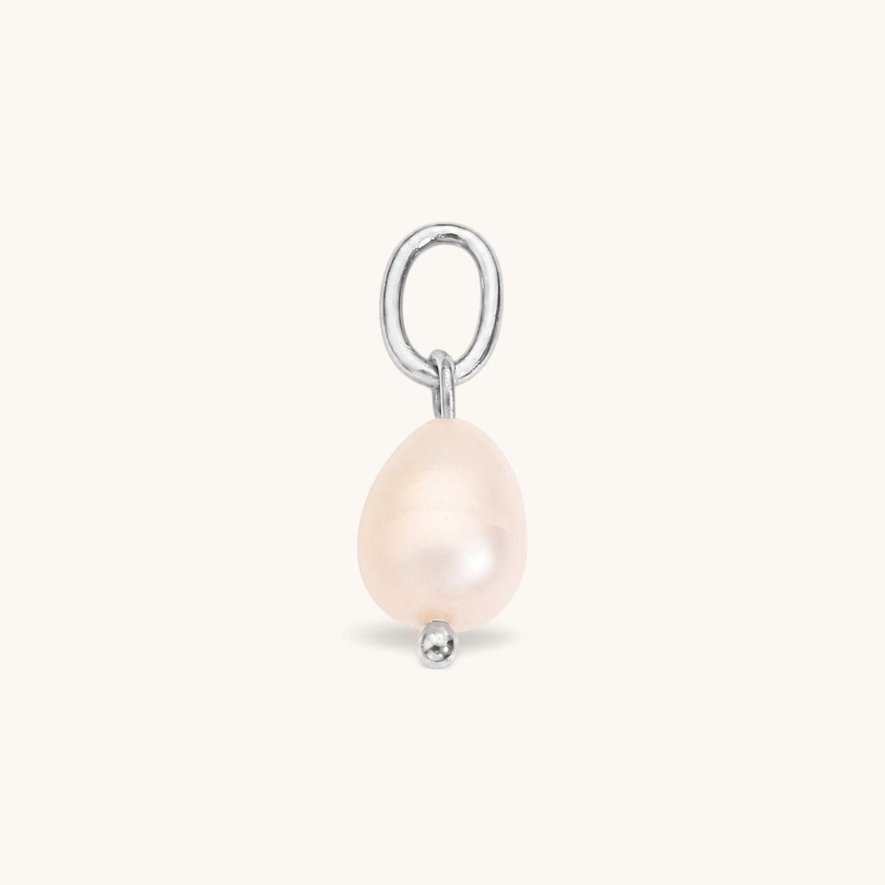 Nadare Co. Pearl Charm featuring an organic freshwater pearl on a silver-toned metal ring for necklace layering.
