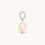 Nadare Co. Pearl Charm featuring an organic freshwater pearl on a silver-toned metal ring for necklace layering.