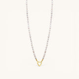 Nadare Co. freshwater pearl necklace featuring a gold heart-shaped clasp from the Switch Charm Collection.