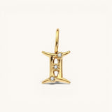 Nadare Co. Gemini zodiac charm in 14k gold-plated stainless steel with sparkling cubic zirconia accents.