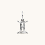 Nadare Co. silver Gemini zodiac charm featuring three small cubic zirconia stones on a stainless steel pendant.