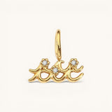Nadare Co. gold-plated Aquarius zodiac charm featuring cubic zirconia accents on a stainless steel base.