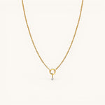 Nadare Co. gold chain necklace featuring a delicate mini birthstone charm on a small circular pendant link.