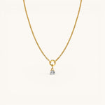 Nadare Co. gold-plated stainless steel round birthstone charm necklace with a sparkling cubic zirconia stone.