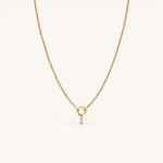 Nadare Co. gold-plated stainless steel necklace featuring a delicate mini cubic zirconia birthstone charm.