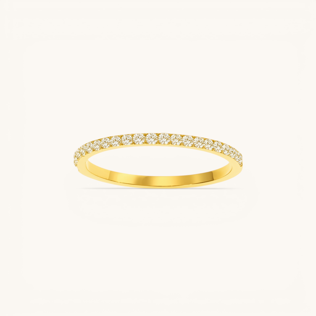 Nadare Co. Prism Birthstone Ring featuring a delicate gold band with a row of sparkling clear stones