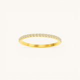 Nadare Co. Prism Birthstone Ring featuring a delicate gold band with a row of sparkling clear stones