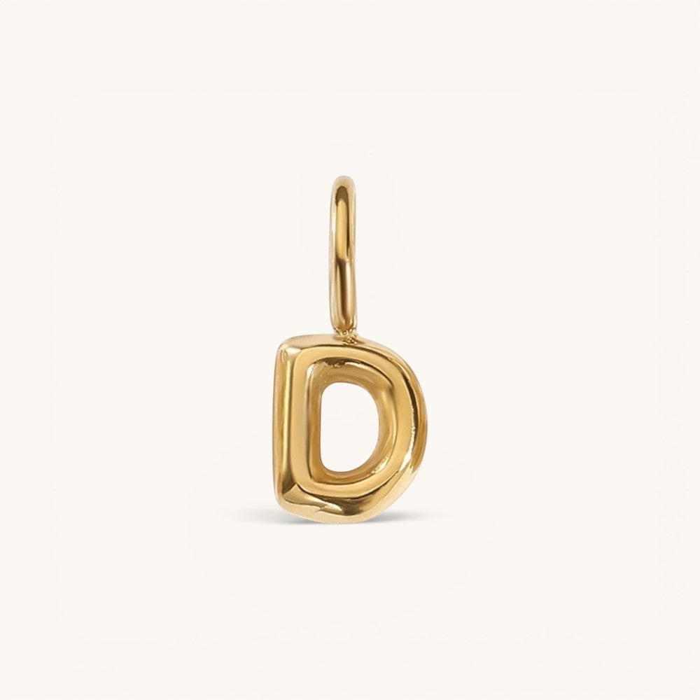 Nadare Co. gold-plated stainless steel bubble initial charm letter D with a rounded, puffed design.