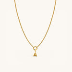 Nadare Co. gold-plated stainless steel bubble initial charm pendant on a delicate chain necklace