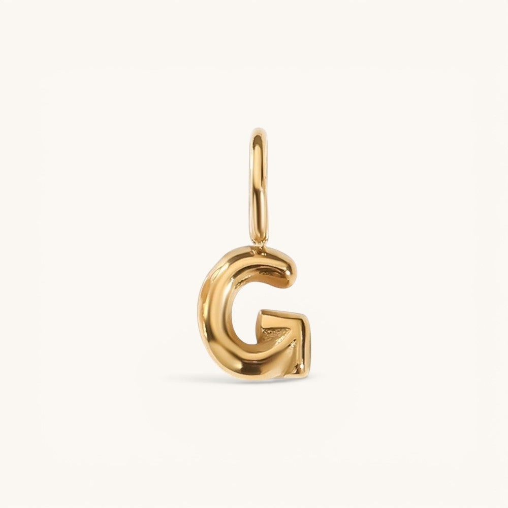 Nadare Co. gold-plated stainless steel bubble initial G charm with a rounded, playful puffed design.