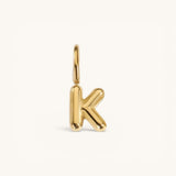 Nadare Co. gold-plated stainless steel bubble letter K charm with a rounded, puffed design for necklace layering.