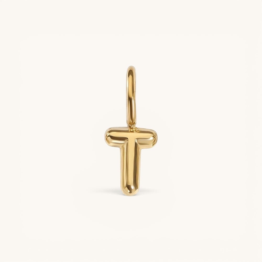 Nadare Co. gold-plated stainless steel bubble initial charm in the shape of the letter T with a rounded, puffed design.