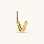 Nadare Co. gold-plated stainless steel bubble initial charm in the shape of the letter V with a rounded finish.