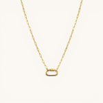 Nadare Co. gold carabiner charm necklace with a modern oval clasp on a delicate paperclip chain