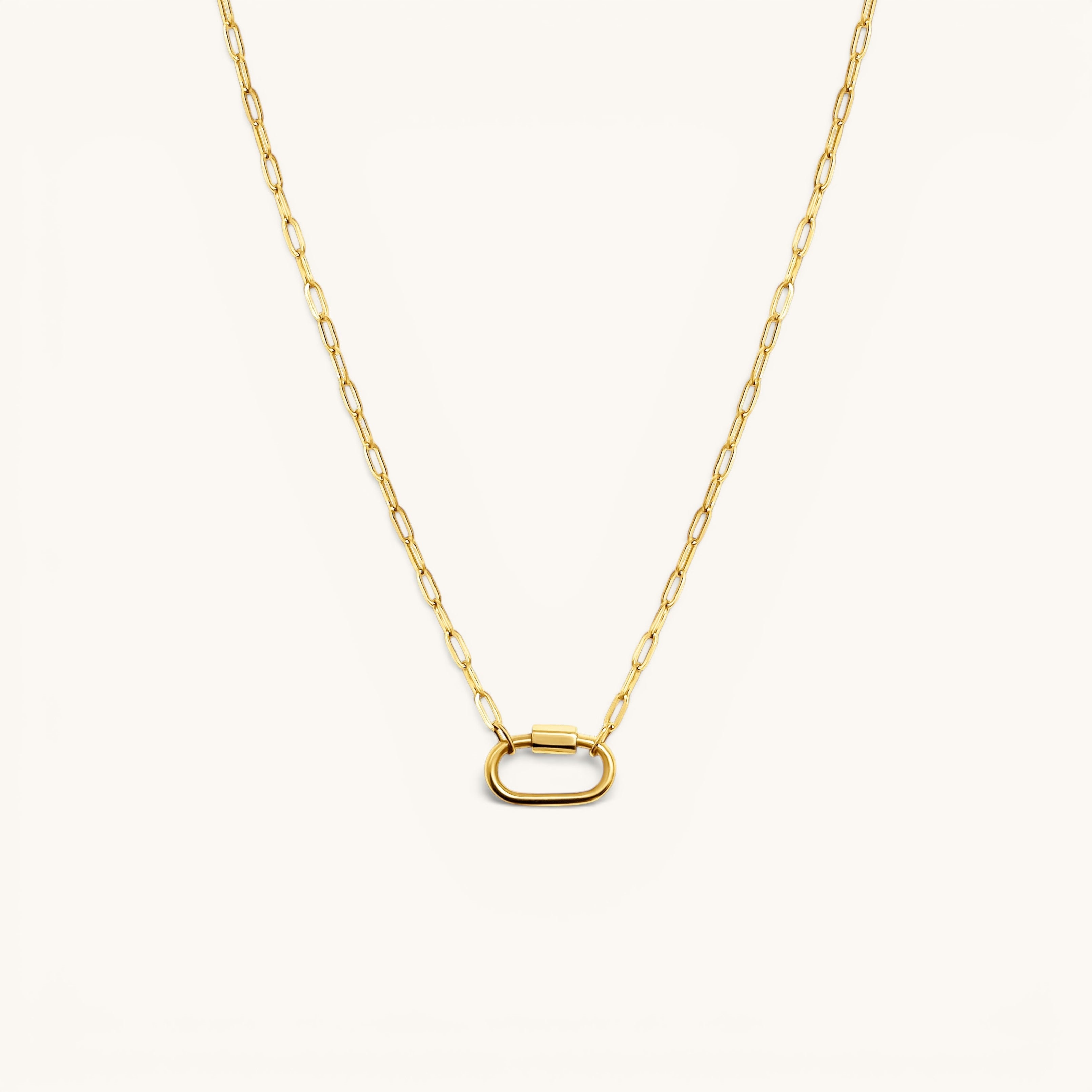 Nadare Co. gold carabiner charm necklace with a modern oval clasp on a delicate paperclip chain