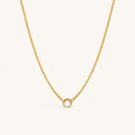Nadare Co. gold plated chain necklace featuring a delicate circular pendant with embedded crystal birthstones.