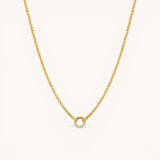 Nadare Co. gold plated chain necklace featuring a delicate circular pendant with embedded crystal birthstones.
