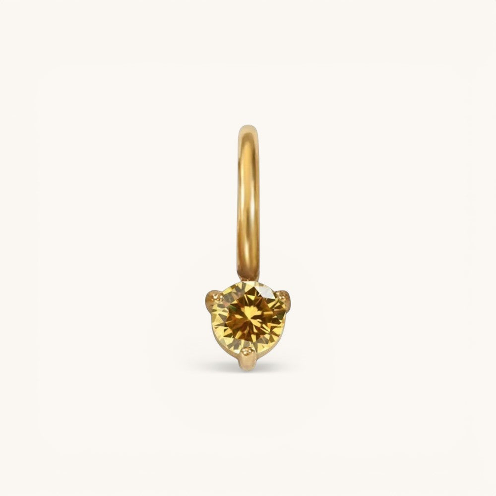 Nadare Co. mini gold hoop charm featuring a round yellow citrine birthstone in a delicate three-prong setting.