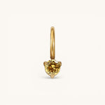 Nadare Co. mini gold hoop charm featuring a round yellow citrine birthstone in a delicate three-prong setting.