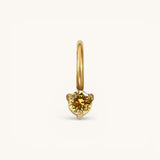 Nadare Co. mini gold hoop charm featuring a round yellow citrine birthstone in a delicate three-prong setting.