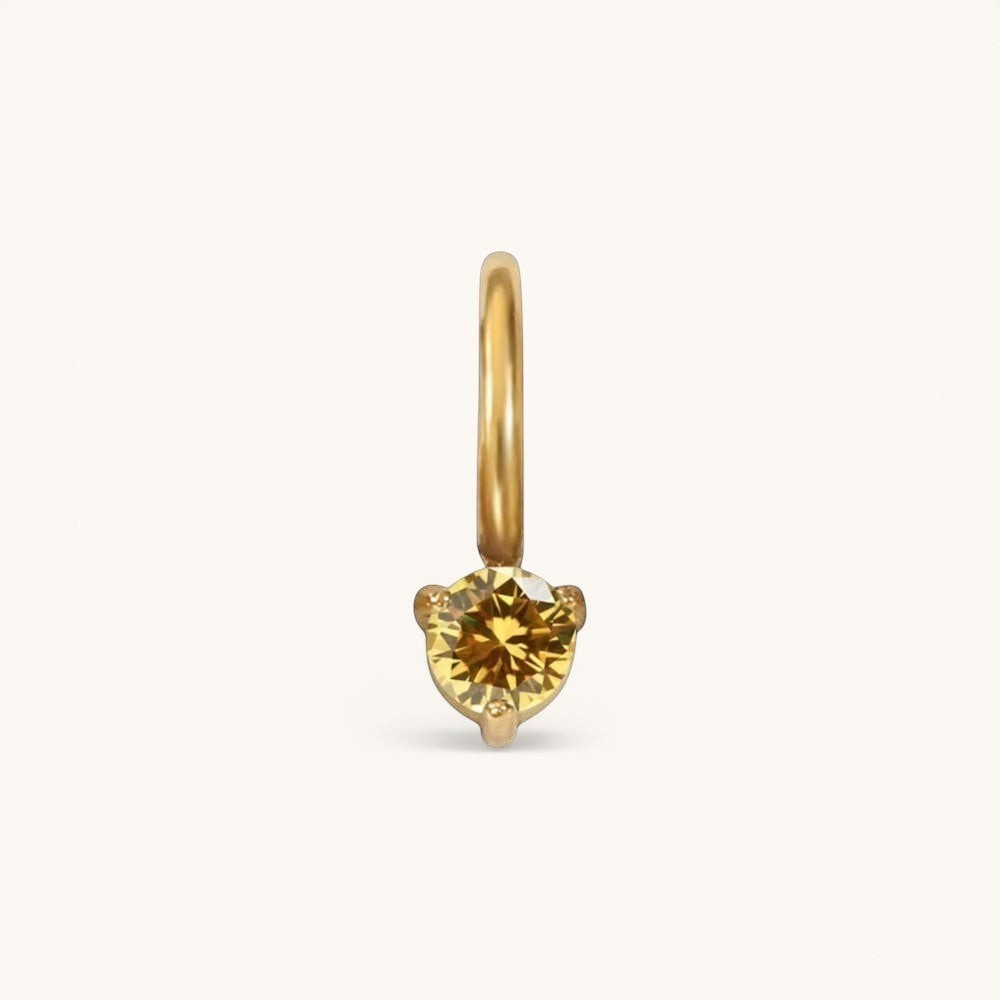 Nadare Co. mini gold hoop charm featuring a round yellow citrine birthstone in a delicate three-prong setting.