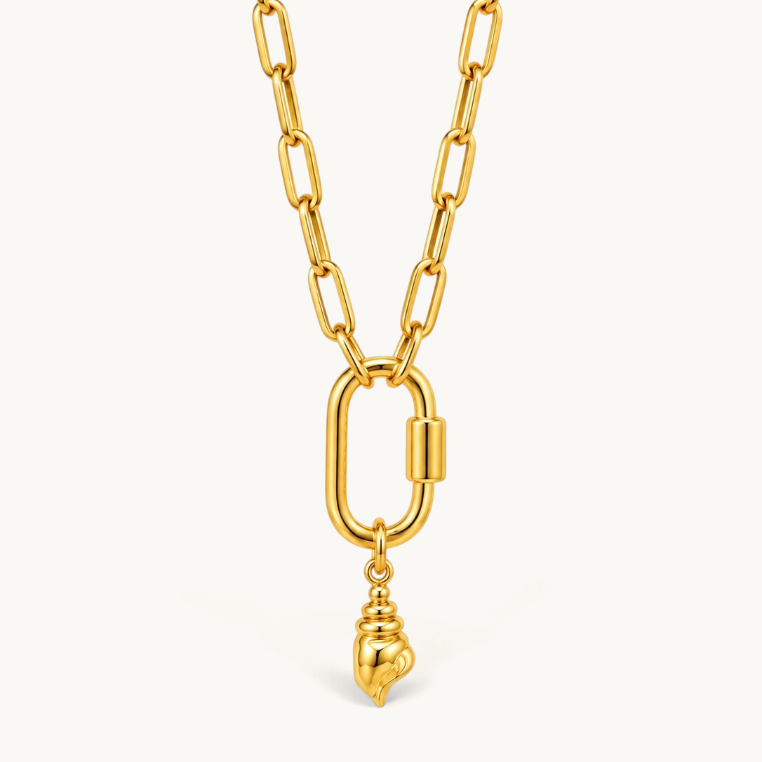 Nadare Co. gold conch shell charm pendant on a thick polished chain link necklace