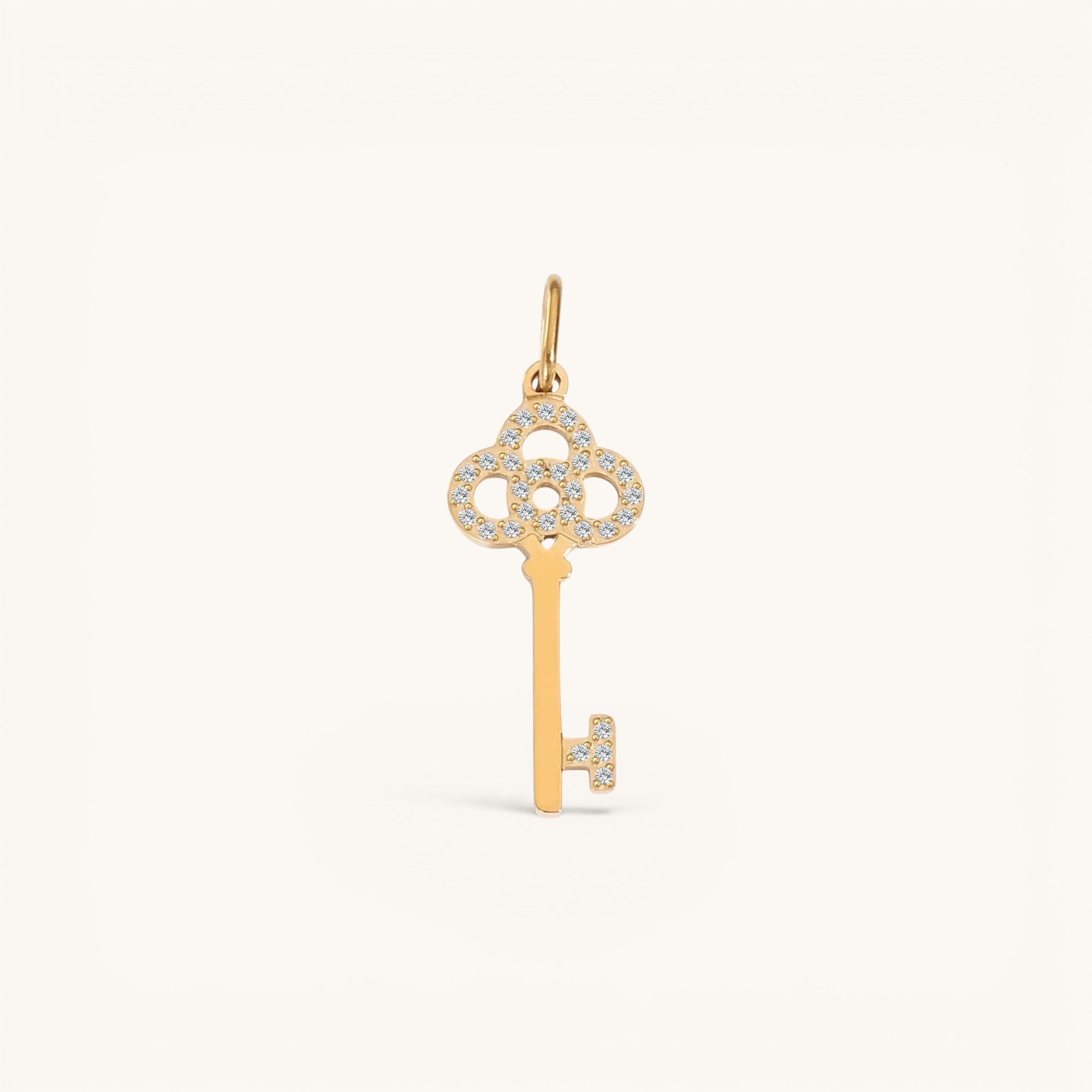 Nadare Co. gold key pendant necklace charm with delicate crystal pavé detailing in a vintage cottagecore style
