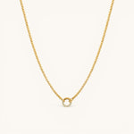 Nadare Co. gold plated stainless steel necklace featuring a circular diamond switch clasp with cubic zirconia stones.