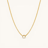 Nadare Co. gold plated stainless steel necklace featuring a circular diamond switch clasp with cubic zirconia stones.
