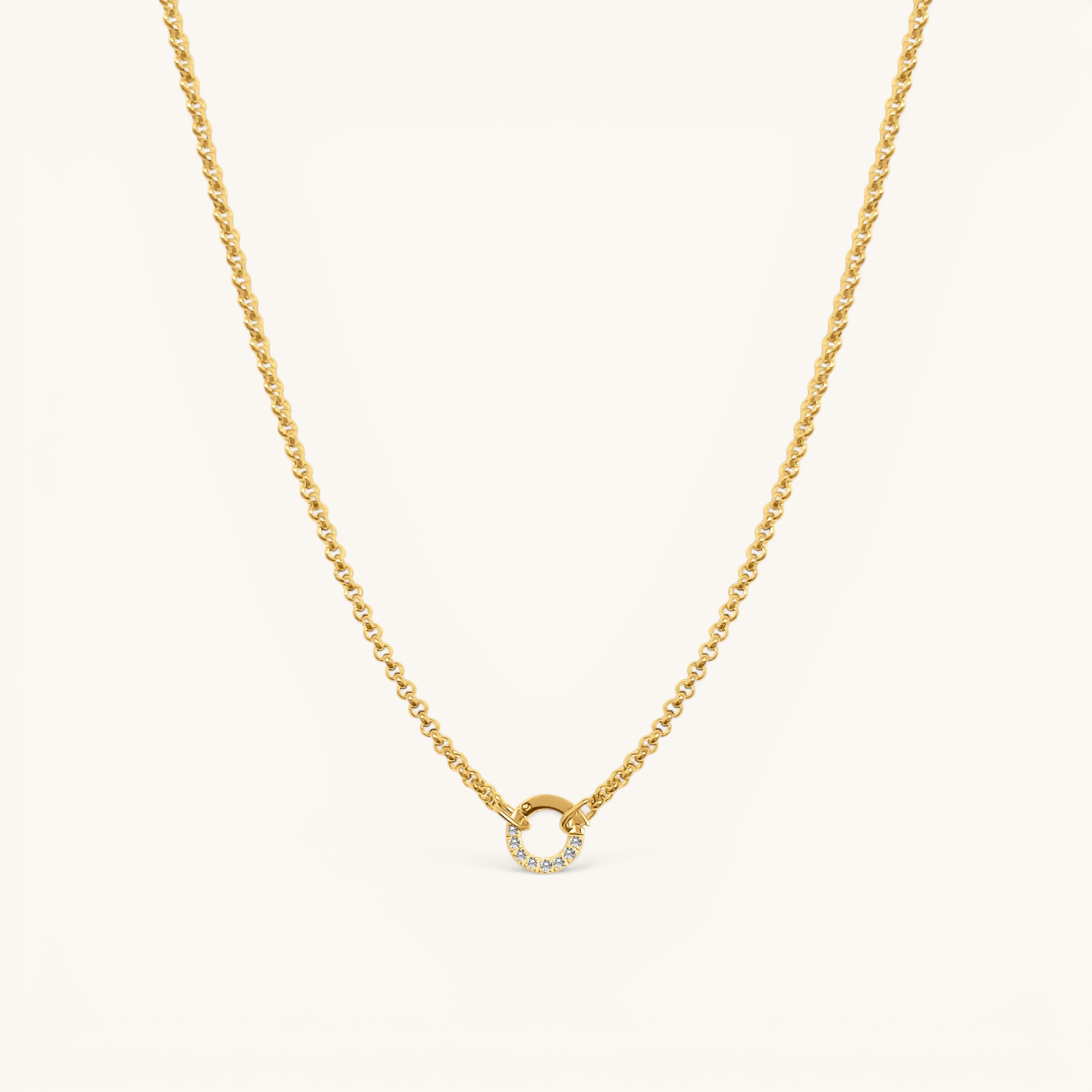 Nadare Co. gold plated stainless steel necklace featuring a circular diamond switch clasp with cubic zirconia stones.