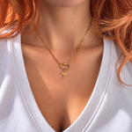 Nadare Co. gold-plated stainless steel elephant charm necklace with an upturned trunk on a delicate chain