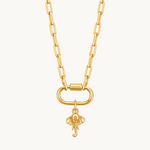 Nadare Co. gold-plated stainless steel elephant charm necklace with a detailed upturned trunk on a link chain.