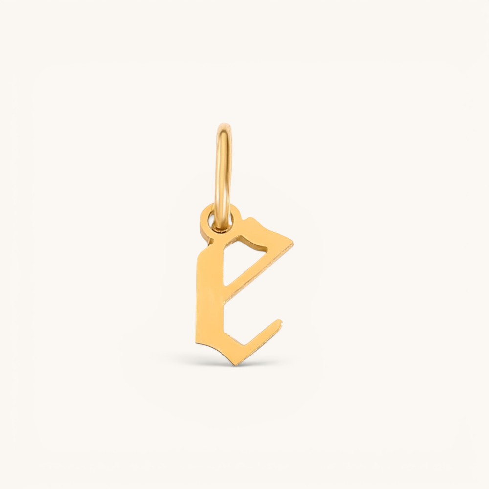 Nadare Co. gold-plated stainless steel gothic letter E charm with sharp edges for necklace stacking.