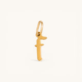 Nadare Co. gold-plated stainless steel gothic letter F charm with sharp edges for a necklace stack.