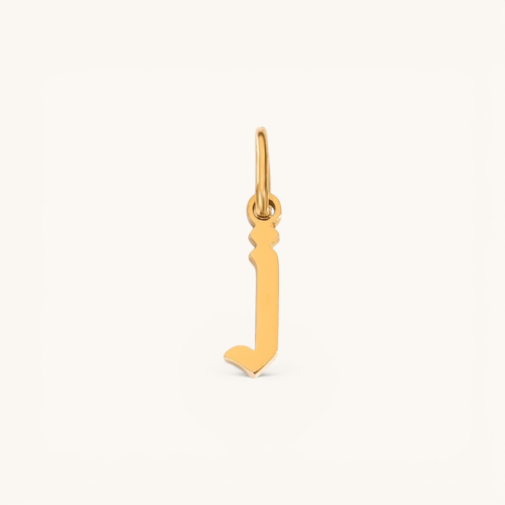 Nadare Co. gold-plated stainless steel gothic letter J charm with sharp edges for a necklace stack.