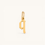 Nadare Co. gothic letter q charm in 14k gold plated stainless steel with sharp edges and a polished finish.