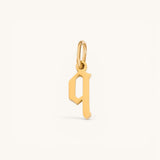Nadare Co. gothic letter q charm in 14k gold plated stainless steel with sharp edges and a polished finish.