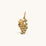 Nadare Co. Grape Charm featuring a sculptural bunch of grapes with detailed leaves in a polished gold finish.