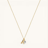 Nadare Co. dainty gold initial necklace with a letter A pendant and a sparkling round birthstone charm.