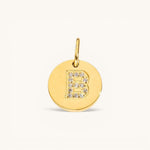 Nadare Co. gold initial charm with pavé crystal letter B on a polished disc.