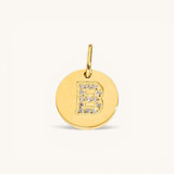 Nadare Co. gold initial charm with pavé crystal letter B on a polished disc.