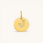 Nadare Co. gold initial charm with pavé set cubic zirconia on a polished disc.