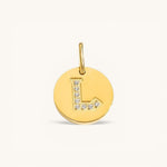 Nadare Co. gold initial charm with pavé diamond letter L on a polished disc.
