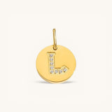 Nadare Co. gold initial charm with pavé diamond letter L on a polished disc.