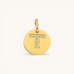 Nadare Co. gold initial charm with pavé set cubic zirconia stones forming the letter T on a polished disc.
