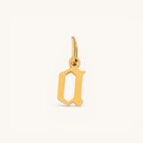 Nadare Co. gold initial charm in a vintage gothic font for a Dark Academia necklace