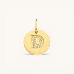 Nadare Co. gold initial D charm with pavé diamond detailing on a polished disc.
