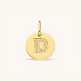 Nadare Co. gold initial D charm with pavé diamond detailing on a polished disc.
