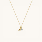 Nadare Co. gold plated stainless steel necklace featuring an uppercase serif letter A charm and a small crystal.